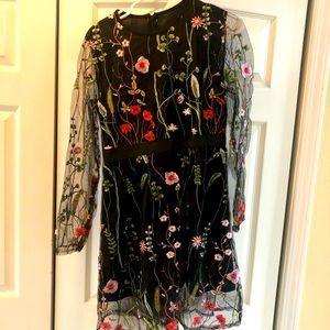 Black embroidered floral dress.